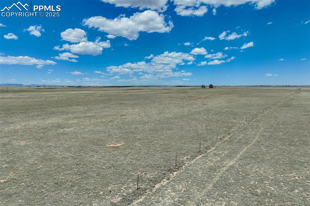 Image 12 of 20: View of undeveloped land with rural landscape