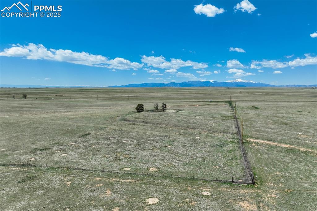 Image 13 of 20: View of mountain backdrop with rural landscape