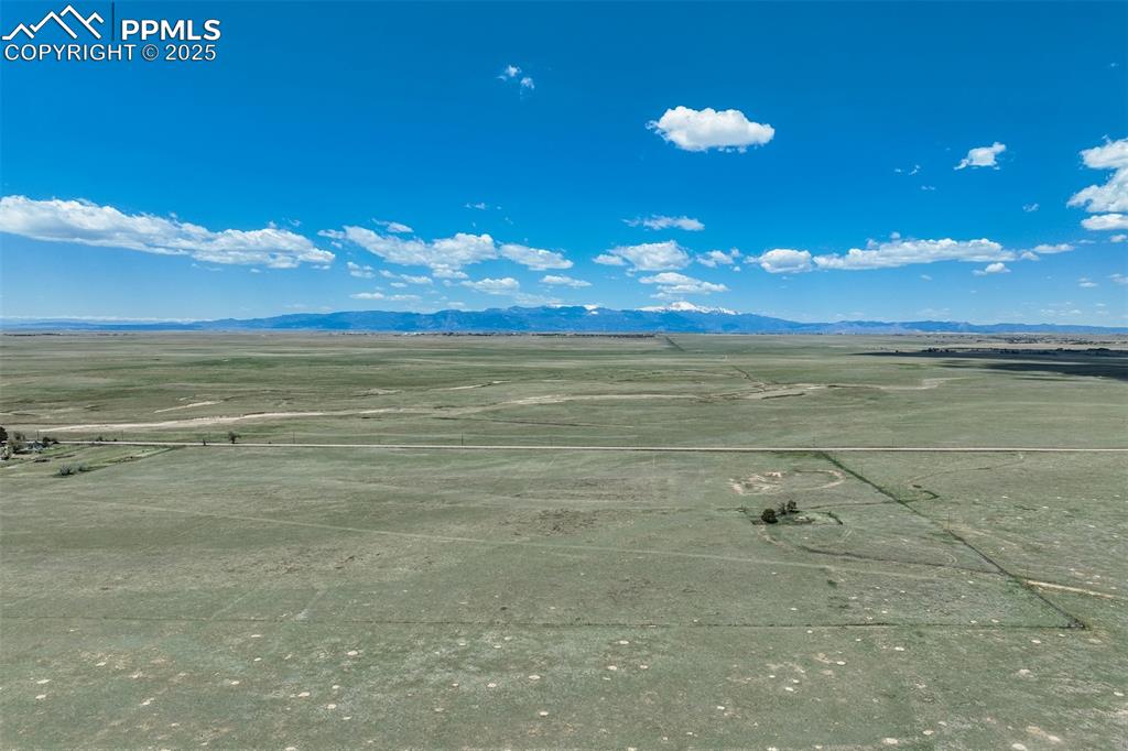 Image 2 of 20: Drone / aerial view of a mountain backdrop