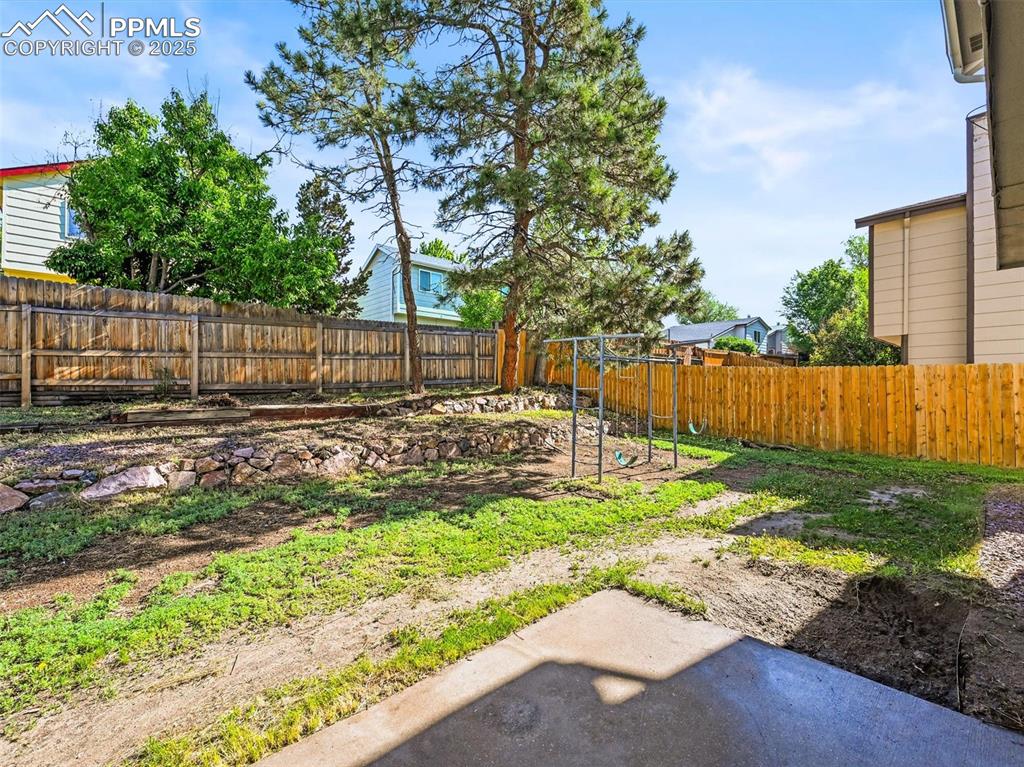Image 26 of 47: View of fenced backyard