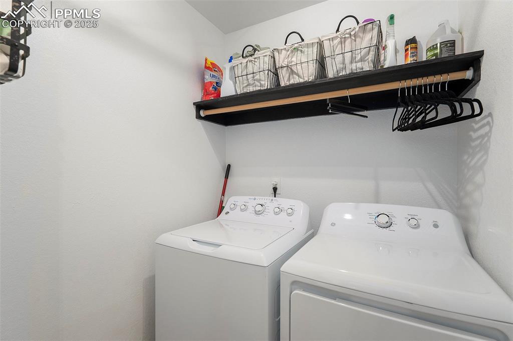Image 19 of 25: Laundry area featuring separate washer and dryer
