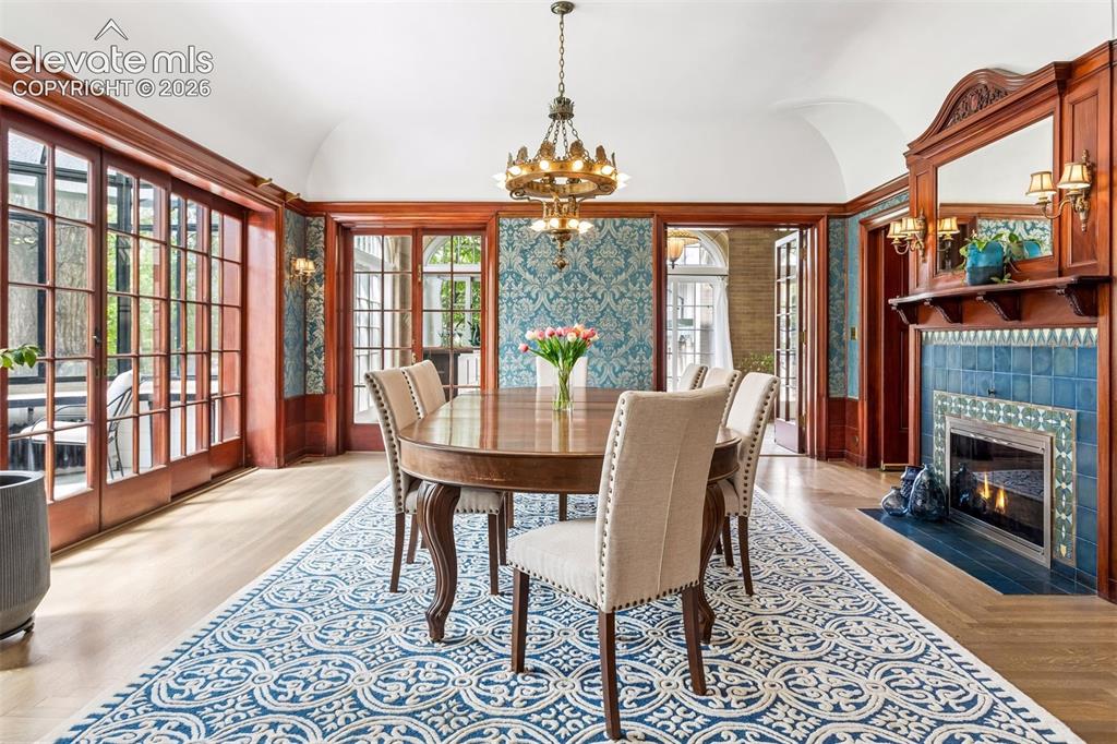 Image 10 of 50: African mahogany wainscoted walls, original tapestry wallpaper, green Van B