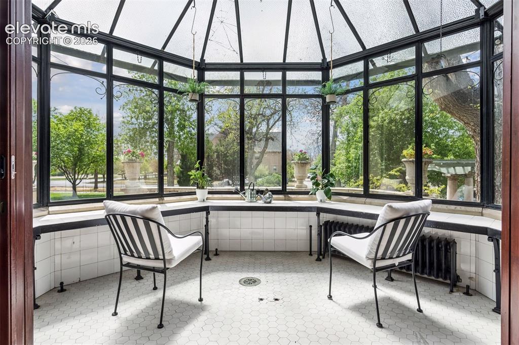 Image 12 of 50: Conservatory built onto the northwest corner of the porch.
preserved green