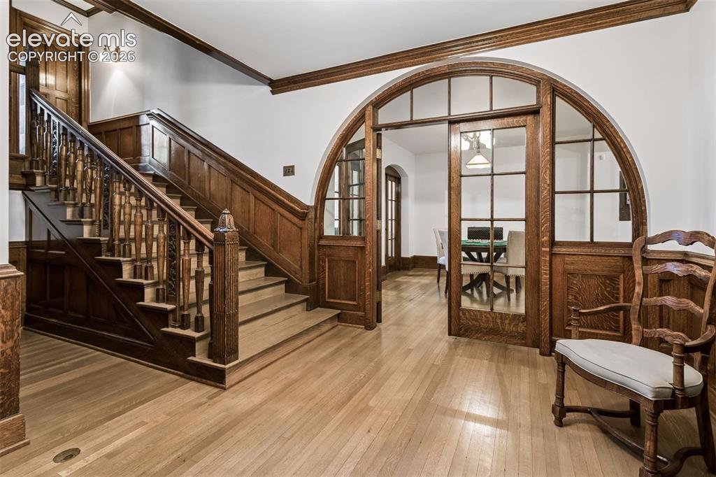 Image 22 of 50: Original oak woodwoork leading to basement