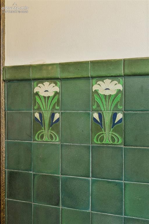 Image 26 of 50: Van Briggle tile adorn the portico entry room