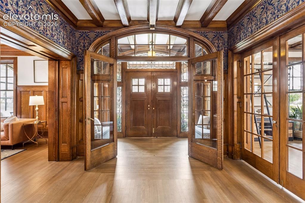 Image 3 of 50: Exquisite hand carved woodwork throughout home