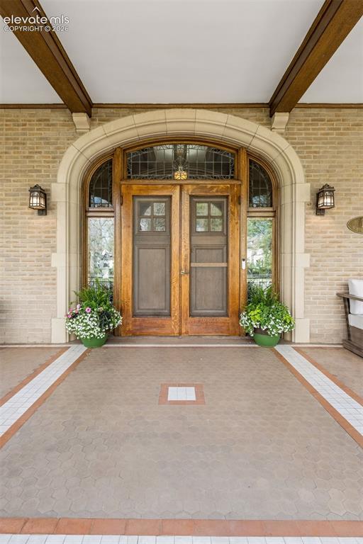 Image 43 of 50: Grand front porch, Original doors