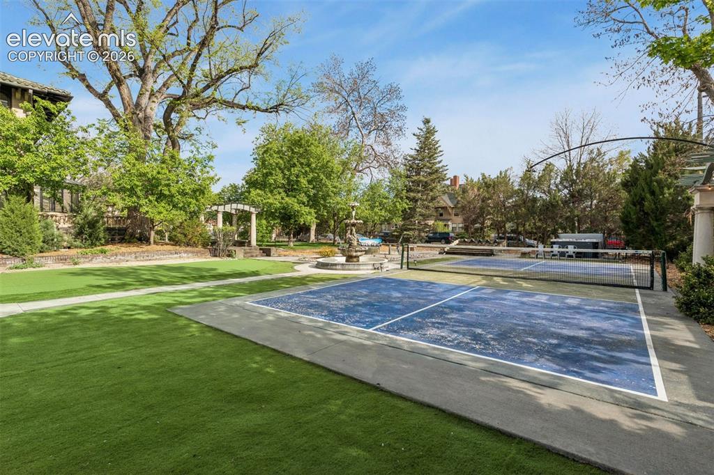 Image 48 of 50: Large putting green and pickleball court.