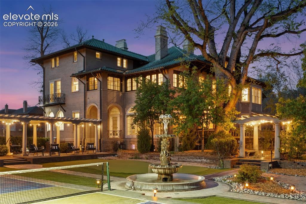 Image 49 of 50: Beautiful estate grounds with fountain, firepit, reflection pool, picklebal