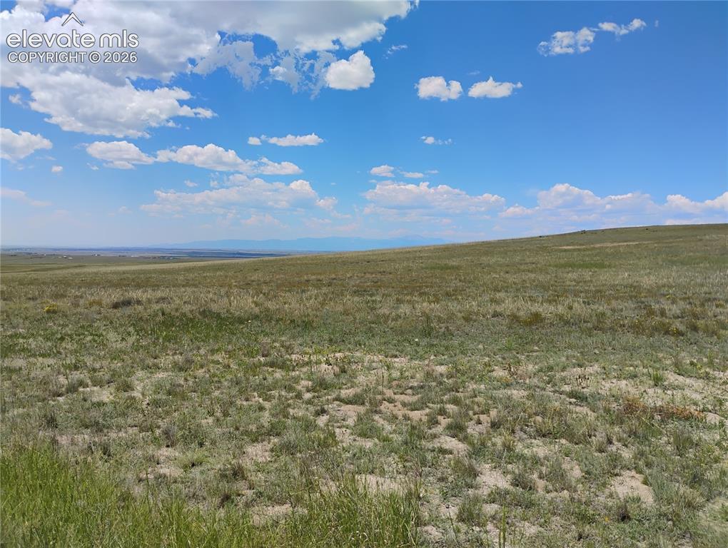 Image 7 of 15: Expansive undeveloped land featuring natural terrain and distant horizon vi