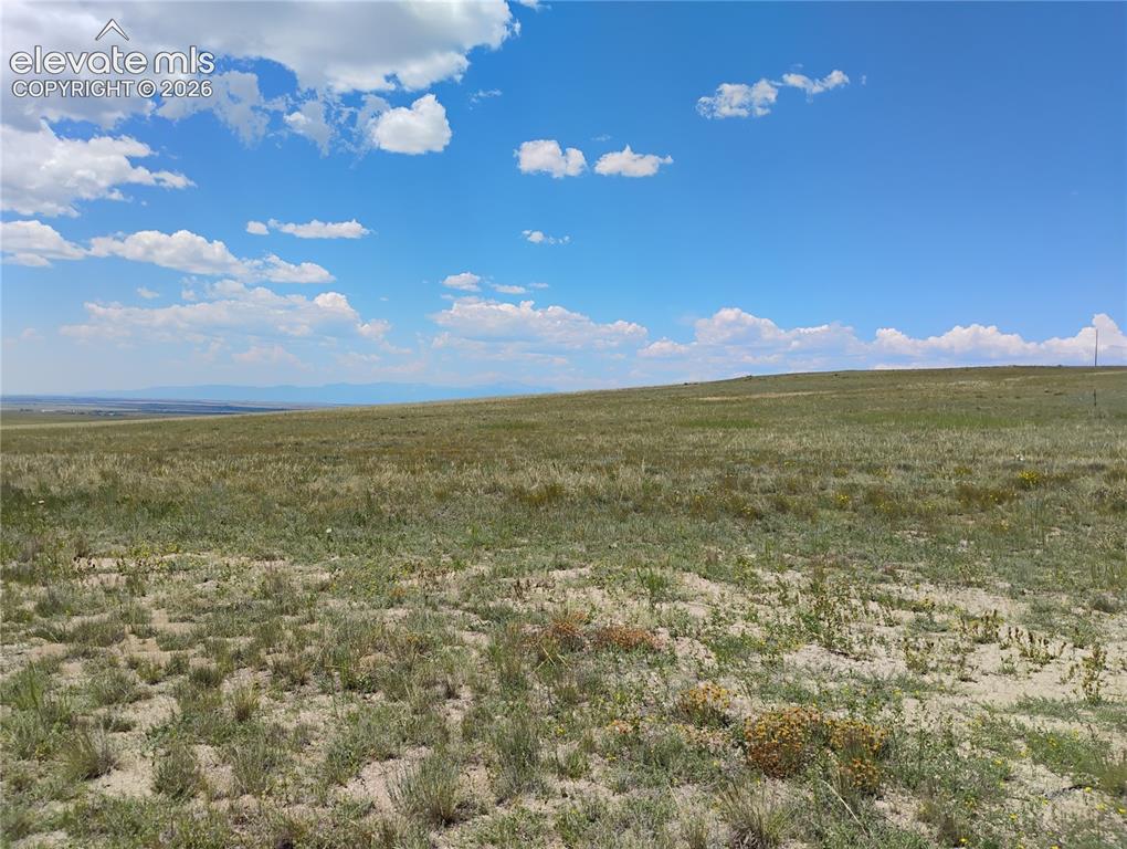 Image 8 of 15: Expansive open land with rolling terrain