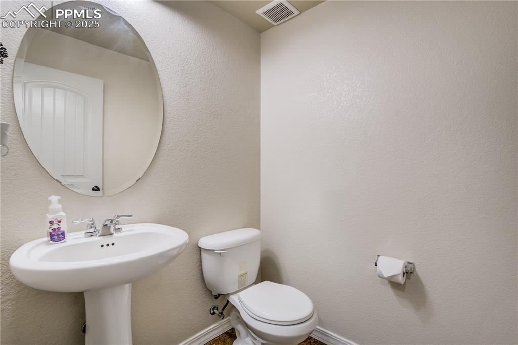Image 15 of 30: Main level guest bathroom