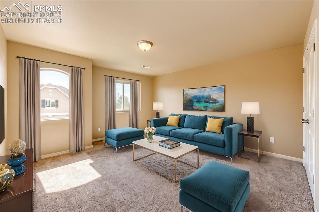 Image 16 of 30: Virtually Staged Loft Space - Additional living space perfect for a living 