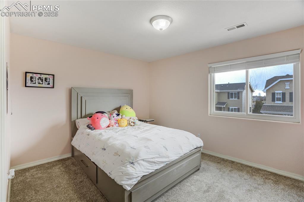 Image 22 of 30: Secondary bedroom with walk-in closet