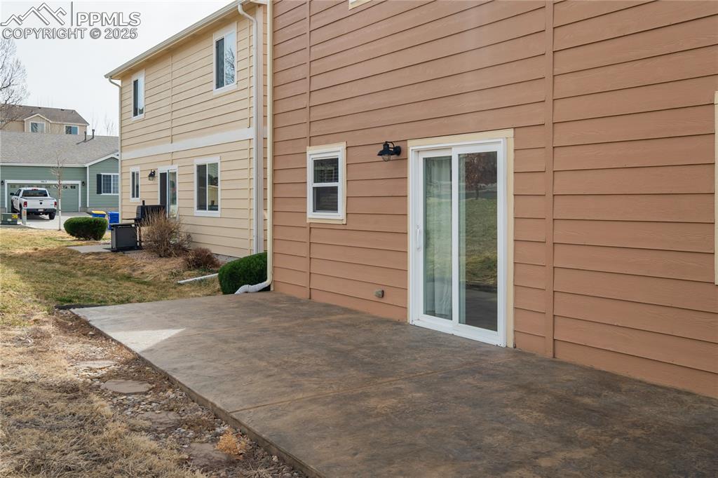 Image 26 of 30: Lovely stamped and stained concrete patio perfect for the summer months