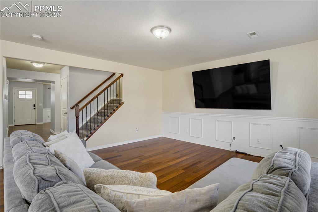 Image 4 of 30: The open floor plan boasts multiple living spaces, like this open secondary