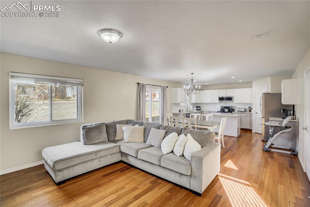 Image 5 of 30: Open to the kitchen and dining room, this space is perfect for family gathe