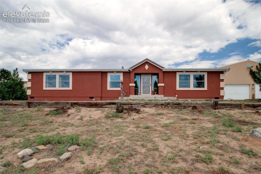 Image 1 of 45: Modular home on permanent foundation with new stucco exterior.
