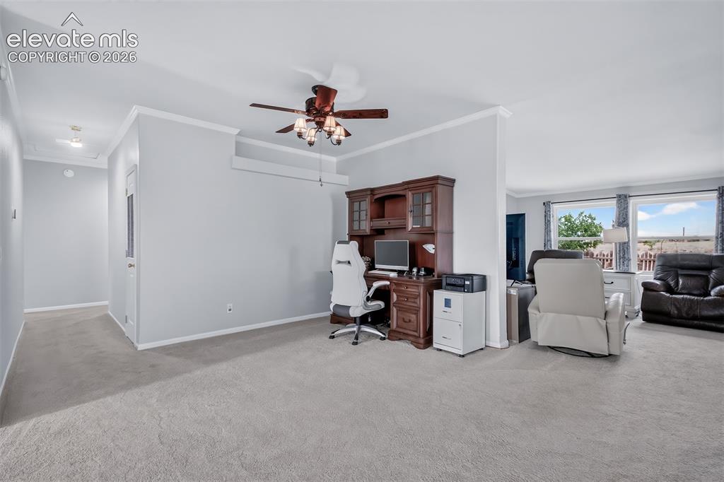 Image 10 of 45: View from living room to dining room which is currently being used as the o