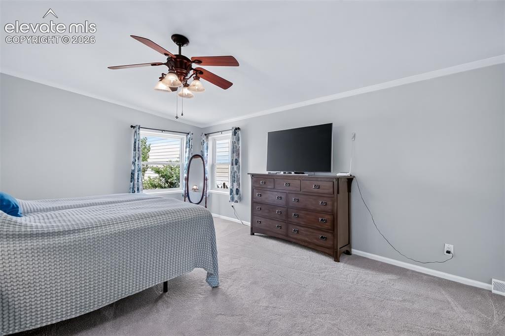 Image 13 of 45: Spacious primary bedroom with adjoining 5 piece bath. New interior paint an