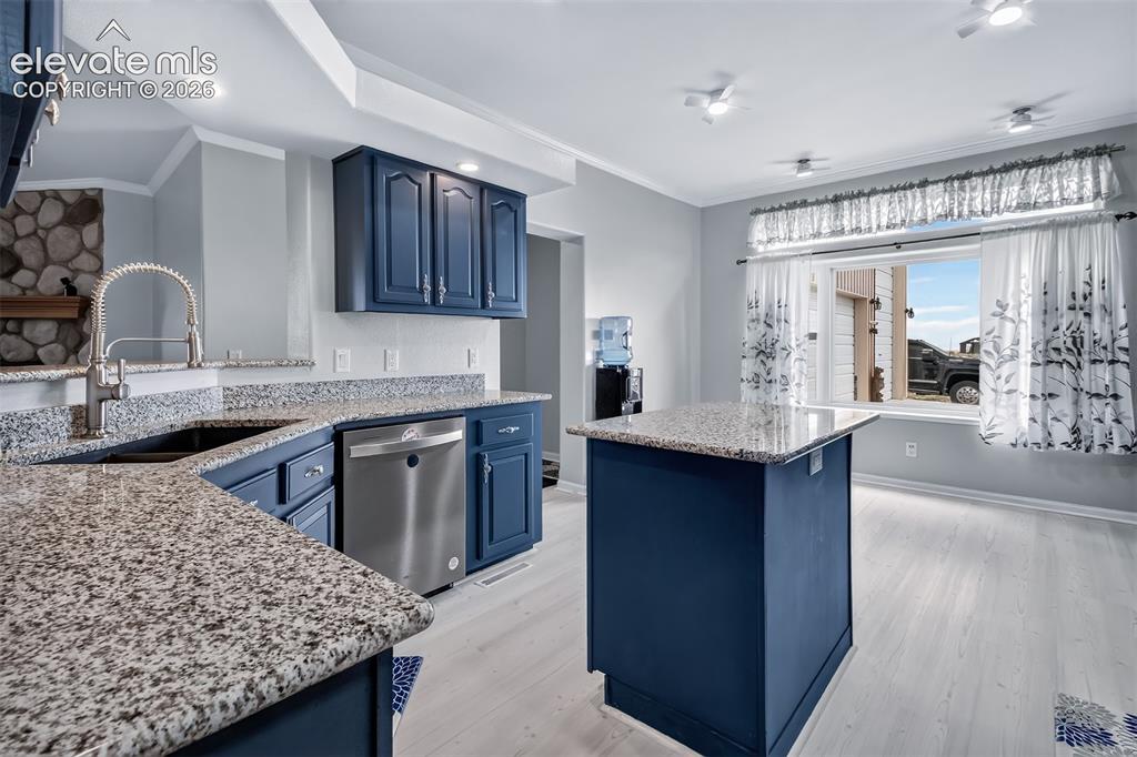 Image 4 of 45: Kitchen has been updated with granite counters. Breakfast nook for addition