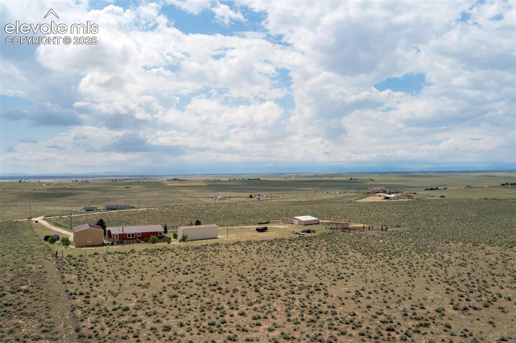 Image 41 of 45: View to the West, to include home and all out buildings.
