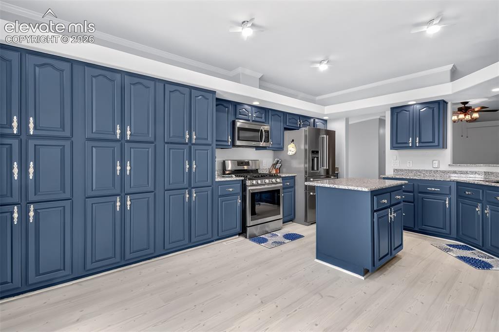 Image 5 of 45: Kitchen has lot of additional cabinet space for storage. New stainless stee