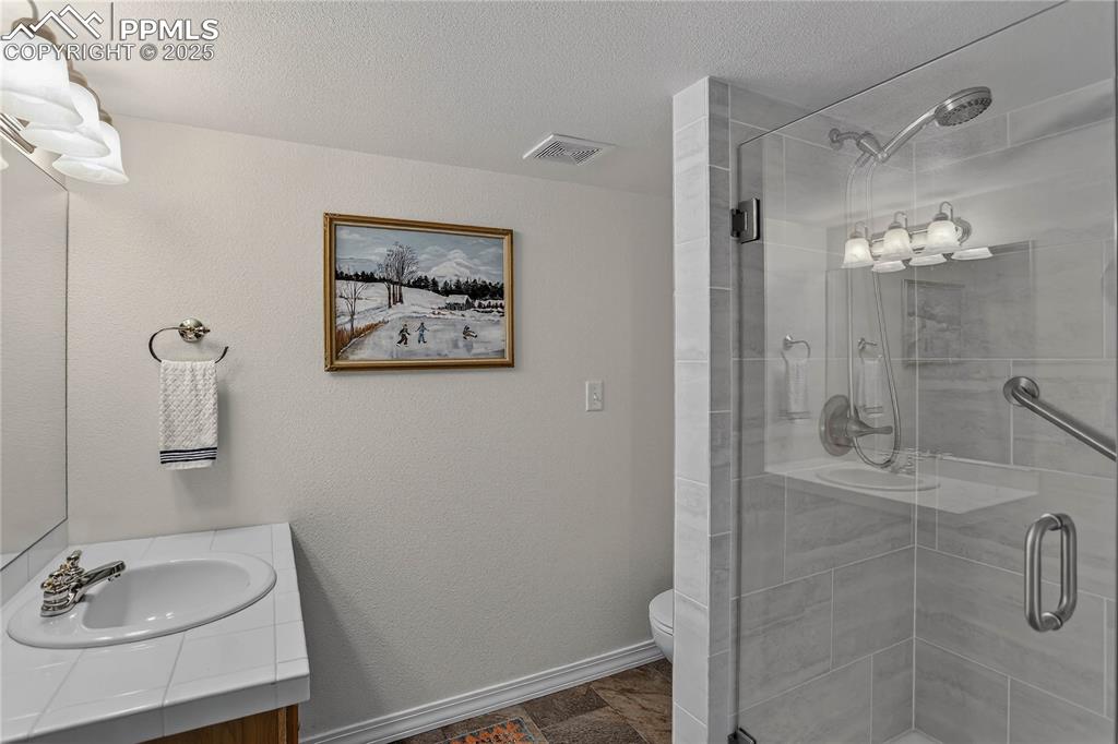 Image 25 of 35: Guest bath - lower level