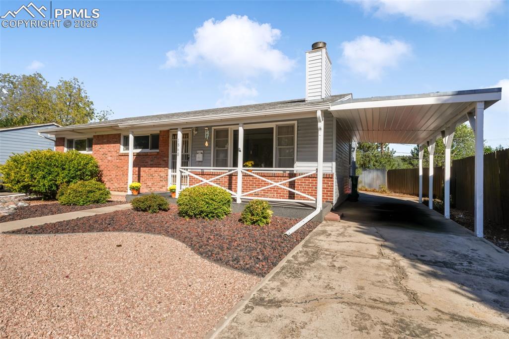 Image 2 of 50: Front exterior with low maintenance landscaping