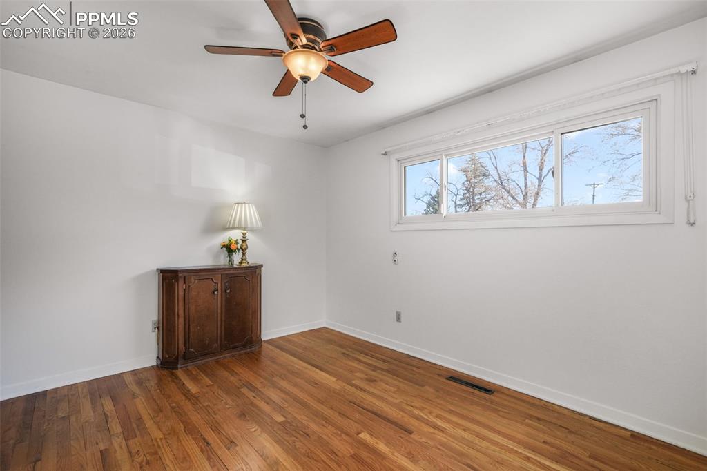 Image 30 of 50: Bedroom two with natural light