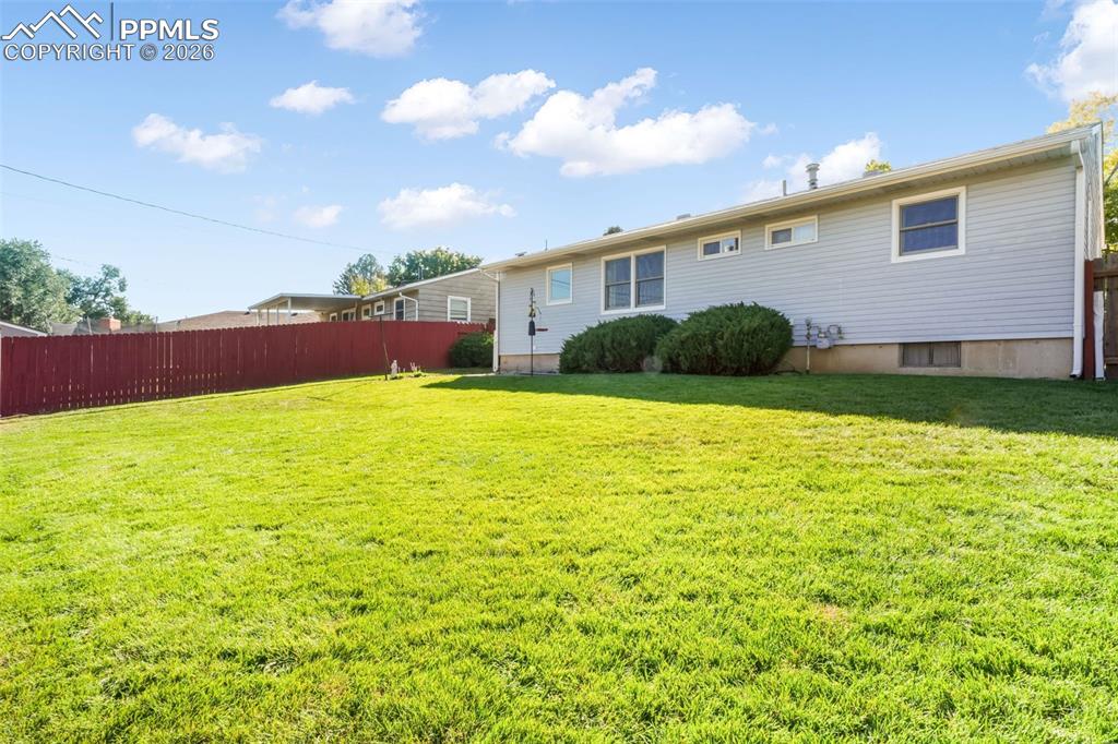 Image 39 of 50: Basement bar and seating area