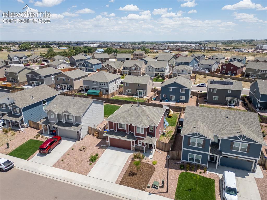 Image 24 of 42: Aerial perspective of a neighborhood with diverse residential properties