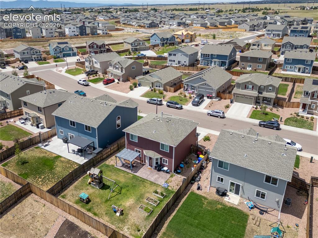 Image 26 of 42: Aerial view showcasing a residential neighborhood with numerous single-fami