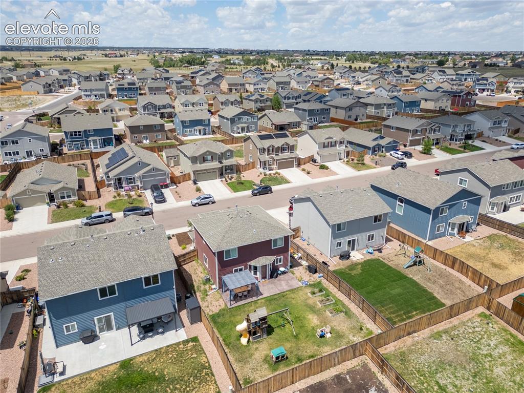 Image 27 of 42: Suburban neighborhood with a variety of residential properties, paved stree