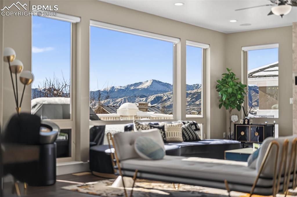 Image 14 of 50: beautiful large windows in Living Room main level, with popping view of Pik