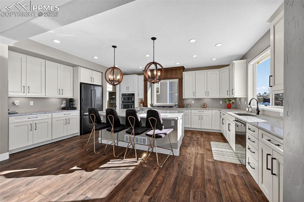 Image 16 of 50: very spacious, large Kitchen, with pantry off to the left into next room. K