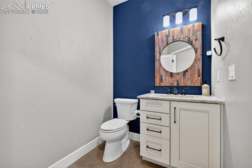 Image 22 of 50: main level 1/2 bath connected to mudroom