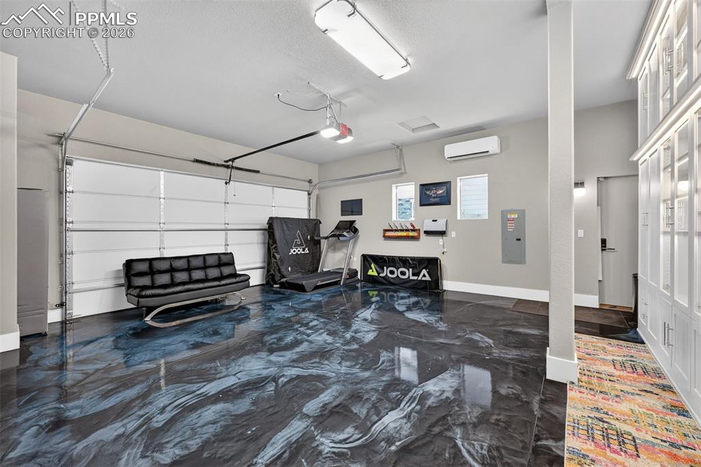 Image 23 of 50: oversized 4 car, finished, insulated, climate controlled, metallic epoxy fl