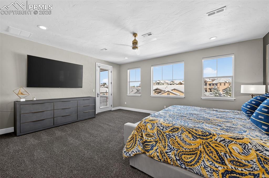 Image 38 of 50: upper level master bedroom