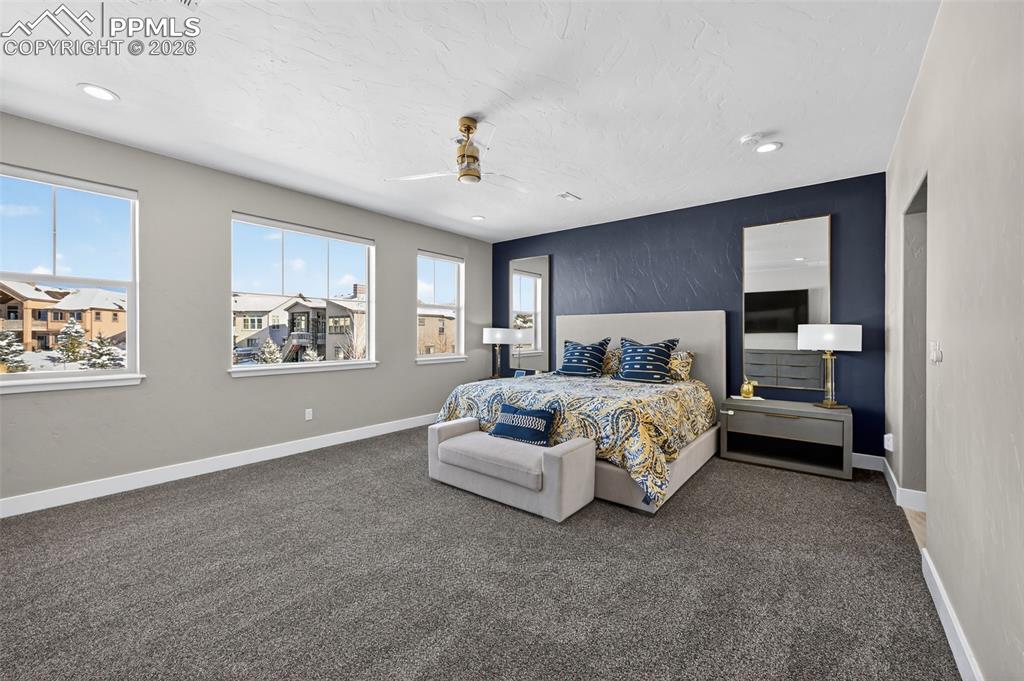 Image 39 of 50: upper level master bedroom