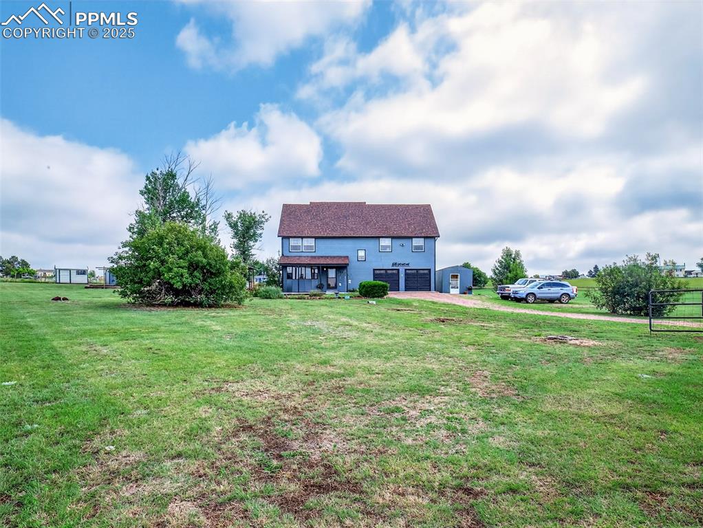 Caption: Front of this lovely home surrounded by 2.5 acres of beautiful property!
