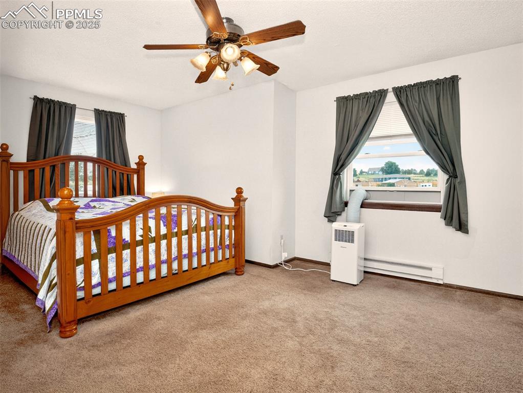 Image 16 of 45: Primary bedroom with walk in closet and en suite full bathroom