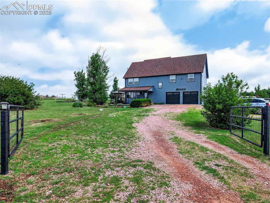 Image 40 of 45: Front of this lovely and quite home surrounded by 2.5 acres