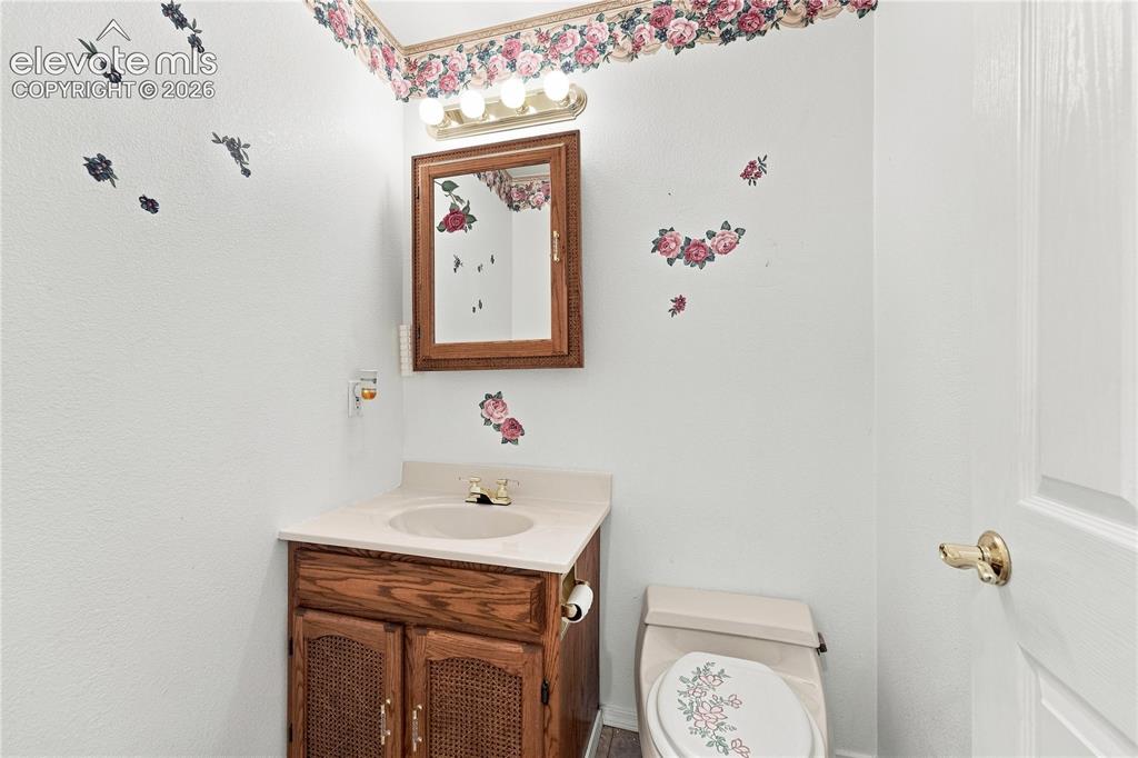 Image 11 of 42: Main level half bath