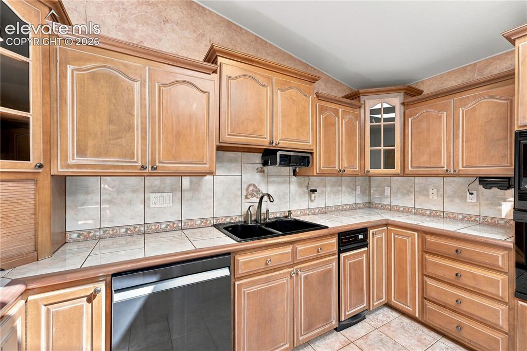 Image 8 of 42: Trash compactor - upgraded sink - custom cabinets