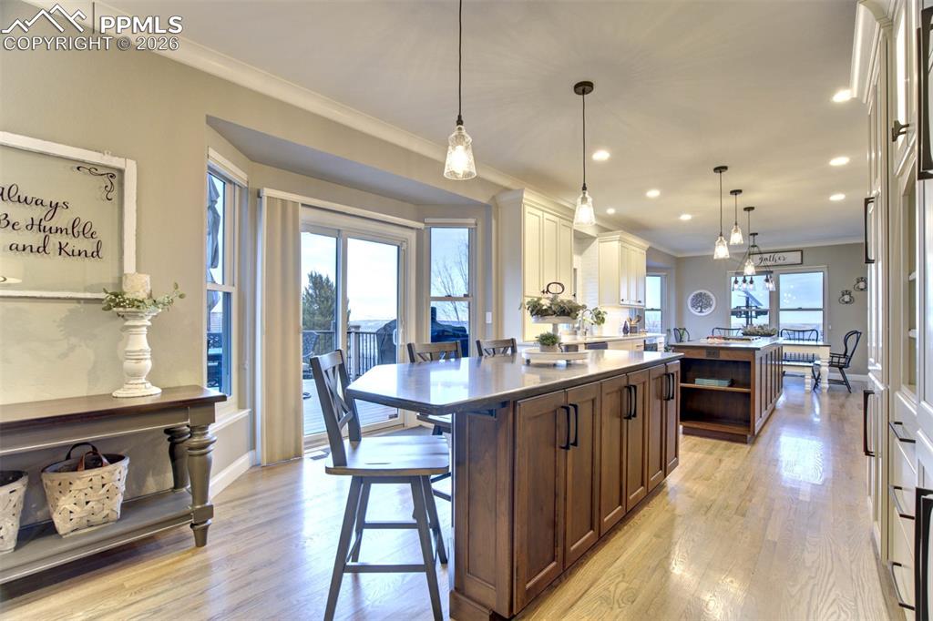 Image 14 of 50: Kitchen showing the second Island with breakfast bar, bay area has sliding
