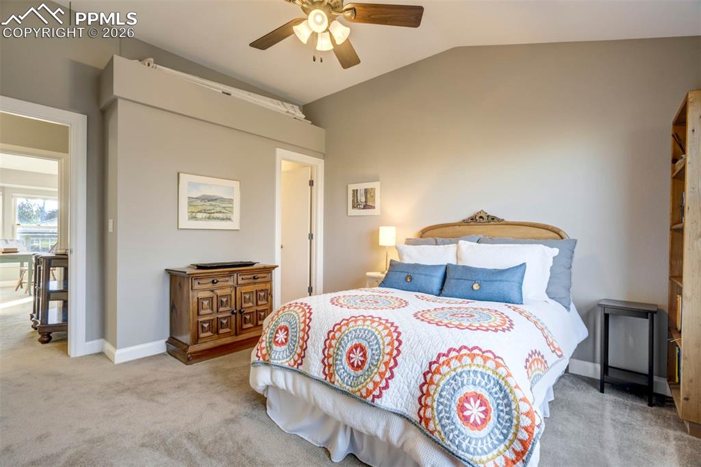 Image 33 of 50: Another view of bedroom 4, the door leads to an ensuite bathroom. Ceiling f
