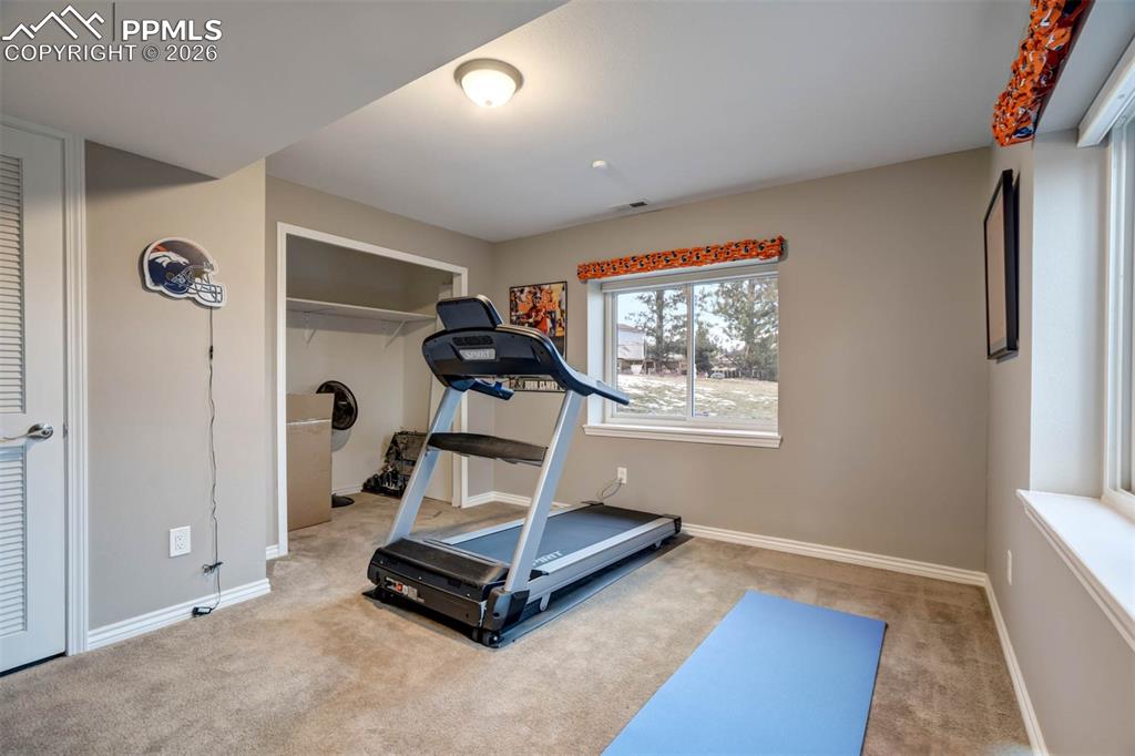 Image 42 of 50: Workout area w/large closet. Door on the left leads to the mechanicals room