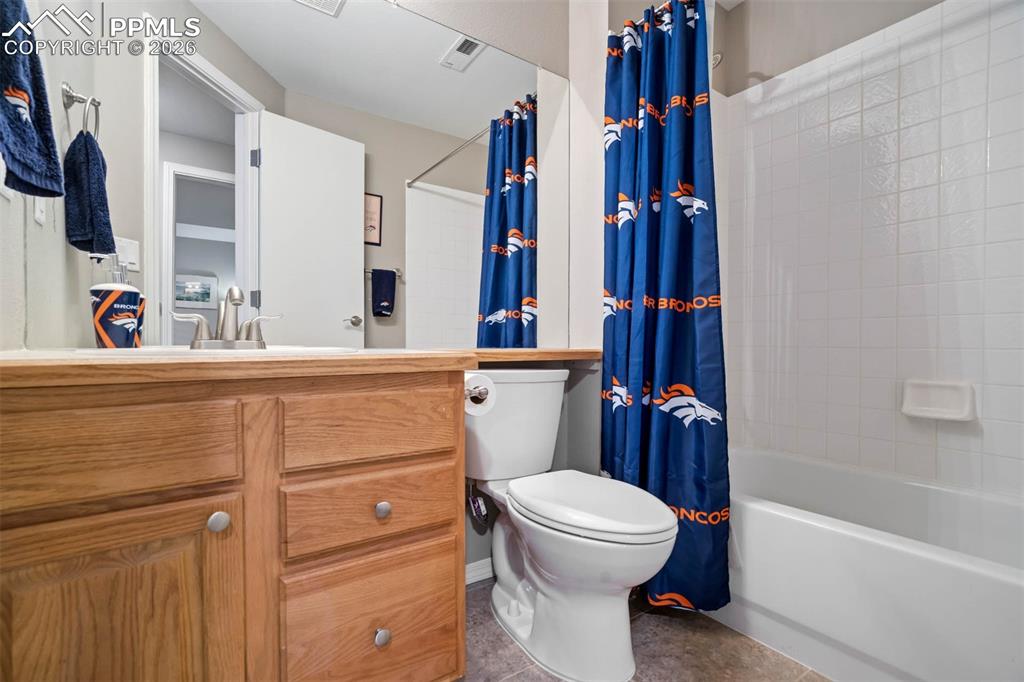 Image 43 of 50: Bathroom 5(basement featuring vanity and shower/bath combo