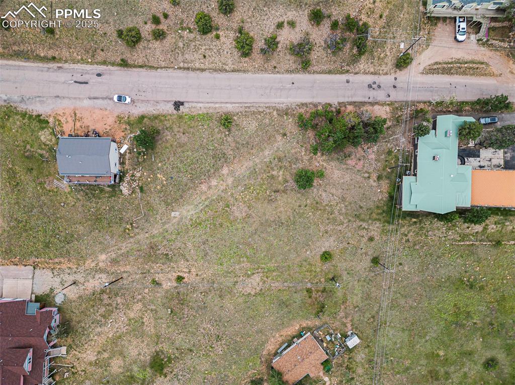 Image 3 of 12: aerial view - property is to the left (north) of the trees